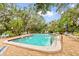 Inviting community pool surrounded by lush landscaping at 6401 Pelican Dr # 80A, Bradenton, FL 34210