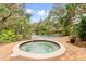 Relaxing community pool and spa with lounge chairs at 6401 Pelican Dr # 80A, Bradenton, FL 34210