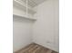 Empty storage room with white shelves and light brown vinyl flooring at 6401 Pelican Dr # 80A, Bradenton, FL 34210