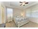 Spacious bedroom with king-size bed, light carpeting and two windows at 6739 Haverhill Ct, Lakewood Ranch, FL 34202