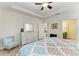 Spacious bedroom with dresser, seating, and ensuite bathroom access at 6739 Haverhill Ct, Lakewood Ranch, FL 34202