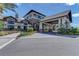 Community center entrance with covered portico and landscaping at 6739 Haverhill Ct, Lakewood Ranch, FL 34202