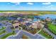 Aerial view of community center with pool, tennis courts, and parking at 6739 Haverhill Ct, Lakewood Ranch, FL 34202
