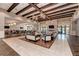 Community room with seating areas, dining tables and a fireplace at 6739 Haverhill Ct, Lakewood Ranch, FL 34202