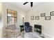 Relaxing den featuring a comfortable armchair and built-in shelving at 6739 Haverhill Ct, Lakewood Ranch, FL 34202