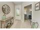 Bright and airy entryway with a view into a cozy den at 6739 Haverhill Ct, Lakewood Ranch, FL 34202