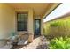 Inviting front patio with seating area and lush greenery at 6739 Haverhill Ct, Lakewood Ranch, FL 34202