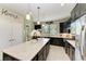 Modern kitchen with dark cabinetry, stainless steel appliances and an island at 6739 Haverhill Ct, Lakewood Ranch, FL 34202