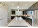 Spacious kitchen with dark cabinetry, quartz countertops, and a large island at 6739 Haverhill Ct, Lakewood Ranch, FL 34202