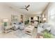 Open living room with neutral color palette and ample natural light at 6739 Haverhill Ct, Lakewood Ranch, FL 34202