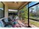 Relaxing screened porch with patio furniture and yard views at 6739 Haverhill Ct, Lakewood Ranch, FL 34202
