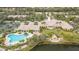 Resort-style community with pool, clubhouse, and ample parking at 7561 Pesaro Dr, Sarasota, FL 34238