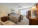 Main bedroom with ample space and built-in wooden furniture at 7561 Pesaro Dr, Sarasota, FL 34238