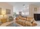 Open living area with view into dining room and kitchen at 7561 Pesaro Dr, Sarasota, FL 34238