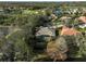 Aerial view of home highlighting backyard pool and lush landscaping at 7939 Treesdale Gln, Lakewood Ranch, FL 34202