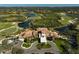 Community clubhouse with adjacent golf course and lake at 7939 Treesdale Gln, Lakewood Ranch, FL 34202