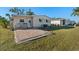 Small brick paved patio behind manufactured home at 808 53Rd E Ave # 226L, Bradenton, FL 34203