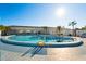 Refreshing kidney-shaped pool with ample lounge chairs at 808 53Rd E Ave # 226L, Bradenton, FL 34203