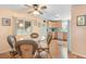 Dining area with glass-top table and wicker chairs near kitchen at 808 53Rd E Ave # 226L, Bradenton, FL 34203