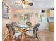 Small dining area with wicker chairs and glass table at 808 53Rd E Ave # 226L, Bradenton, FL 34203