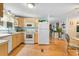 Efficient kitchen with light wood cabinets and modern appliances at 808 53Rd E Ave # 226L, Bradenton, FL 34203