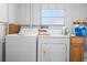 Laundry room with washer, dryer, and storage cabinets at 808 53Rd E Ave # 226L, Bradenton, FL 34203