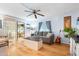 Living room with gray couch, coffee table, and hardwood floors at 808 53Rd E Ave # 226L, Bradenton, FL 34203