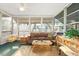 Relaxing sunroom with wicker furniture and large windows at 808 53Rd E Ave # 226L, Bradenton, FL 34203