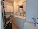 Laundry room with washer, dryer, and cabinets at 8435 Regal Way, Palmetto, FL 34221