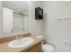 Clean bathroom with single sink vanity and shower at 8908 White Sage Loop, Lakewood Ranch, FL 34202