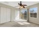 Spacious bedroom with ceiling fan, double closets and access to balcony at 8908 White Sage Loop, Lakewood Ranch, FL 34202