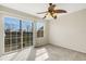 Bedroom features a ceiling fan and access to balcony at 8908 White Sage Loop, Lakewood Ranch, FL 34202