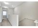 Upstairs hallway with carpet and access to bedrooms at 8908 White Sage Loop, Lakewood Ranch, FL 34202