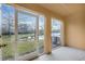 Screened lanai with access to the backyard and lake view at 8908 White Sage Loop, Lakewood Ranch, FL 34202