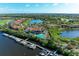 Aerial view of waterfront community with marina and pool at 9711 Sea Turtle Ter # 102, Bradenton, FL 34212