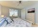 Bedroom with king-size bed, dresser, and view at 9711 Sea Turtle Ter # 102, Bradenton, FL 34212