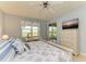 Bedroom with king-size bed, dresser, and view at 9711 Sea Turtle Ter # 102, Bradenton, FL 34212