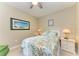 Guest bedroom with queen-size bed and nightstands at 9711 Sea Turtle Ter # 102, Bradenton, FL 34212