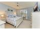 Bedroom with king-size bed and dresser at 9711 Sea Turtle Ter # 102, Bradenton, FL 34212