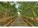 Wooden boardwalk leading to a waterfront area at 9711 Sea Turtle Ter # 102, Bradenton, FL 34212