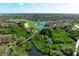 Aerial view of a boardwalk over a lush marsh area at 9711 Sea Turtle Ter # 102, Bradenton, FL 34212