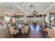 Elegant community dining room with chandeliers and water views at 9711 Sea Turtle Ter # 102, Bradenton, FL 34212