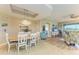 Open concept dining room with view to living room and kitchen at 9711 Sea Turtle Ter # 102, Bradenton, FL 34212