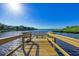 Private wooden dock perfect for fishing and enjoying water views at 9711 Sea Turtle Ter # 102, Bradenton, FL 34212