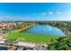 Community driving range overlooking a lake at 9711 Sea Turtle Ter # 102, Bradenton, FL 34212