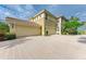 Two-car garage with paver driveway and beautiful landscaping at 9711 Sea Turtle Ter # 102, Bradenton, FL 34212