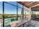 Spacious lanai with outdoor furniture and scenic views at 9711 Sea Turtle Ter # 102, Bradenton, FL 34212