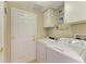 Convenient laundry room with washer and dryer at 9711 Sea Turtle Ter # 102, Bradenton, FL 34212