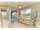 Bright living room with view and access to a screened patio at 9711 Sea Turtle Ter # 102, Bradenton, FL 34212