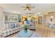 Bright and airy living room with comfortable seating and kitchen views at 9711 Sea Turtle Ter # 102, Bradenton, FL 34212
